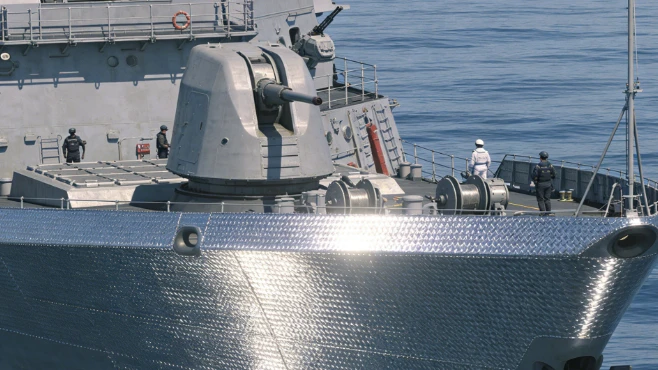 How does titanium alloy protect naval vessels?